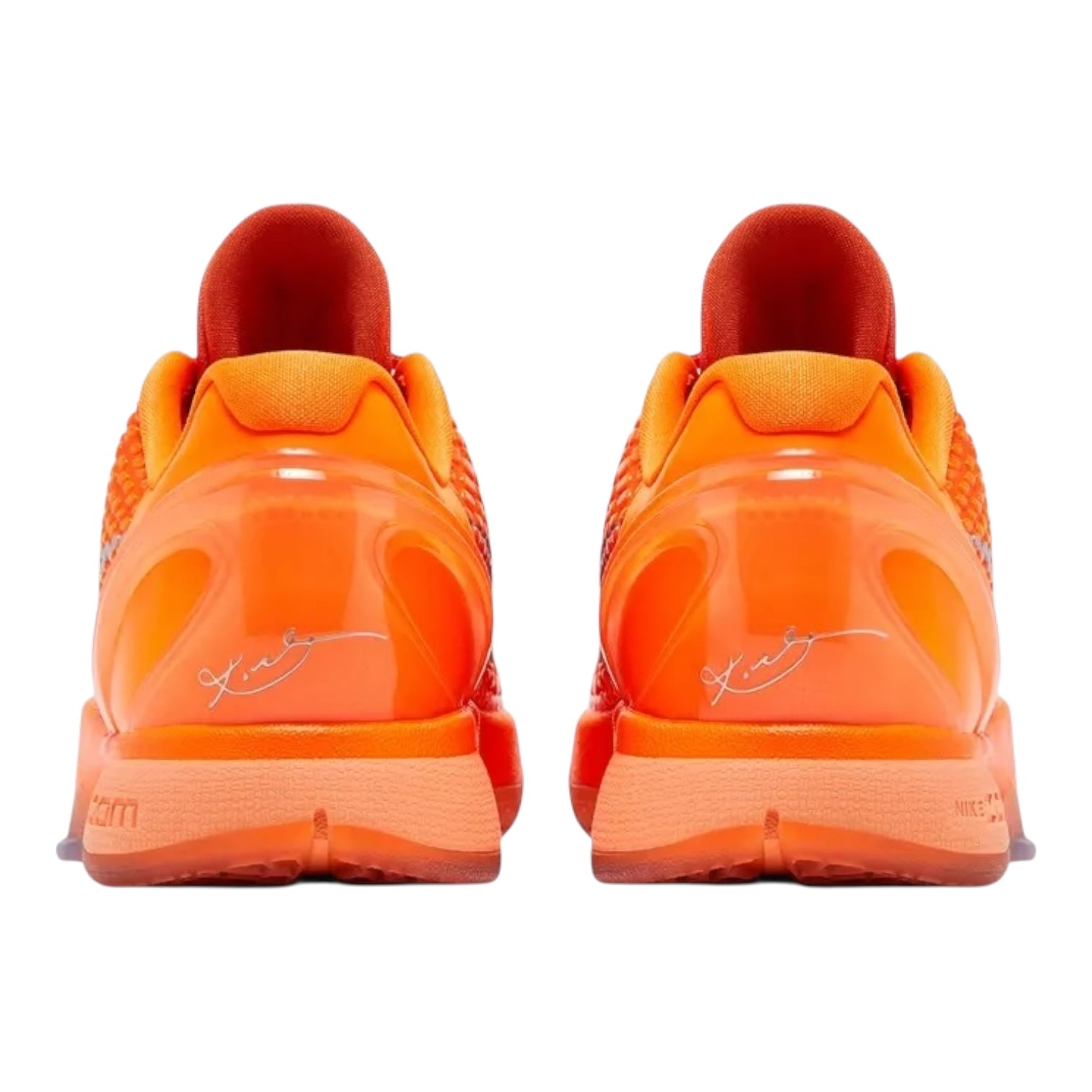 Pair of bright orange sneakers with a visible brand logo on a white background