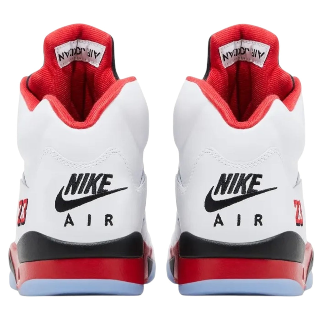 White and red Nike Air sneakers with black accents on a white background