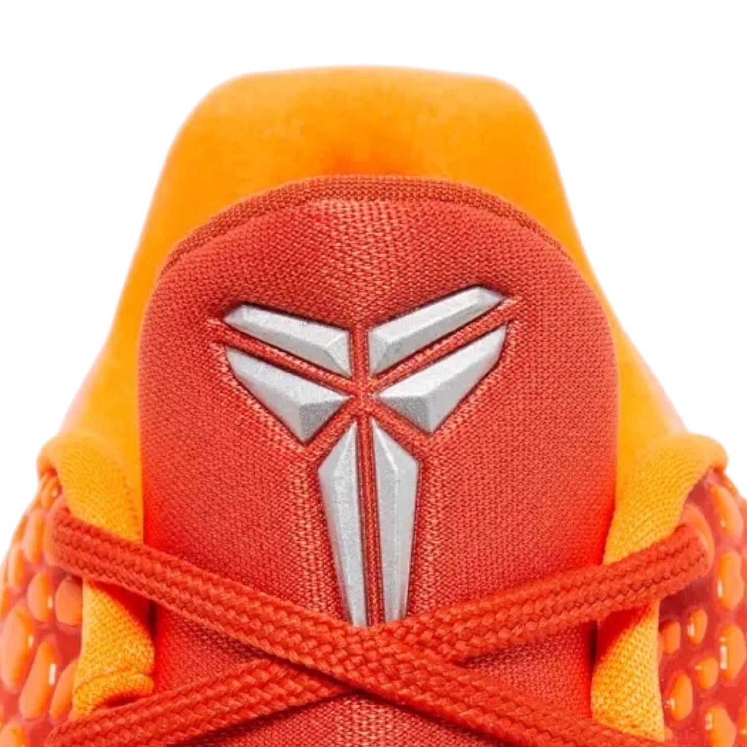 Close-up of an orange and red sneaker with a logo on a white background