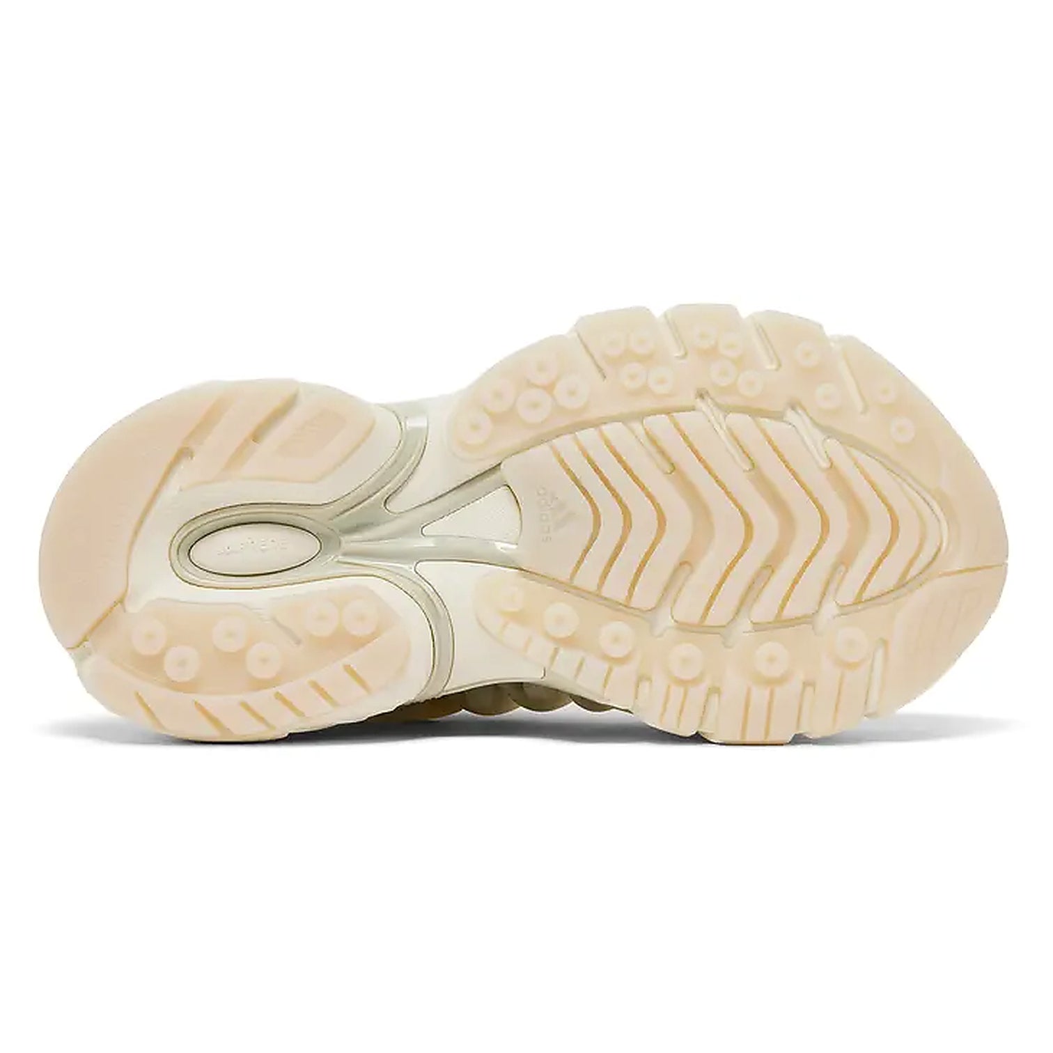 The outsole of a beige athletic sneaker, showing detailed tread patterns and cushioned sections, photographed on a clean white background.