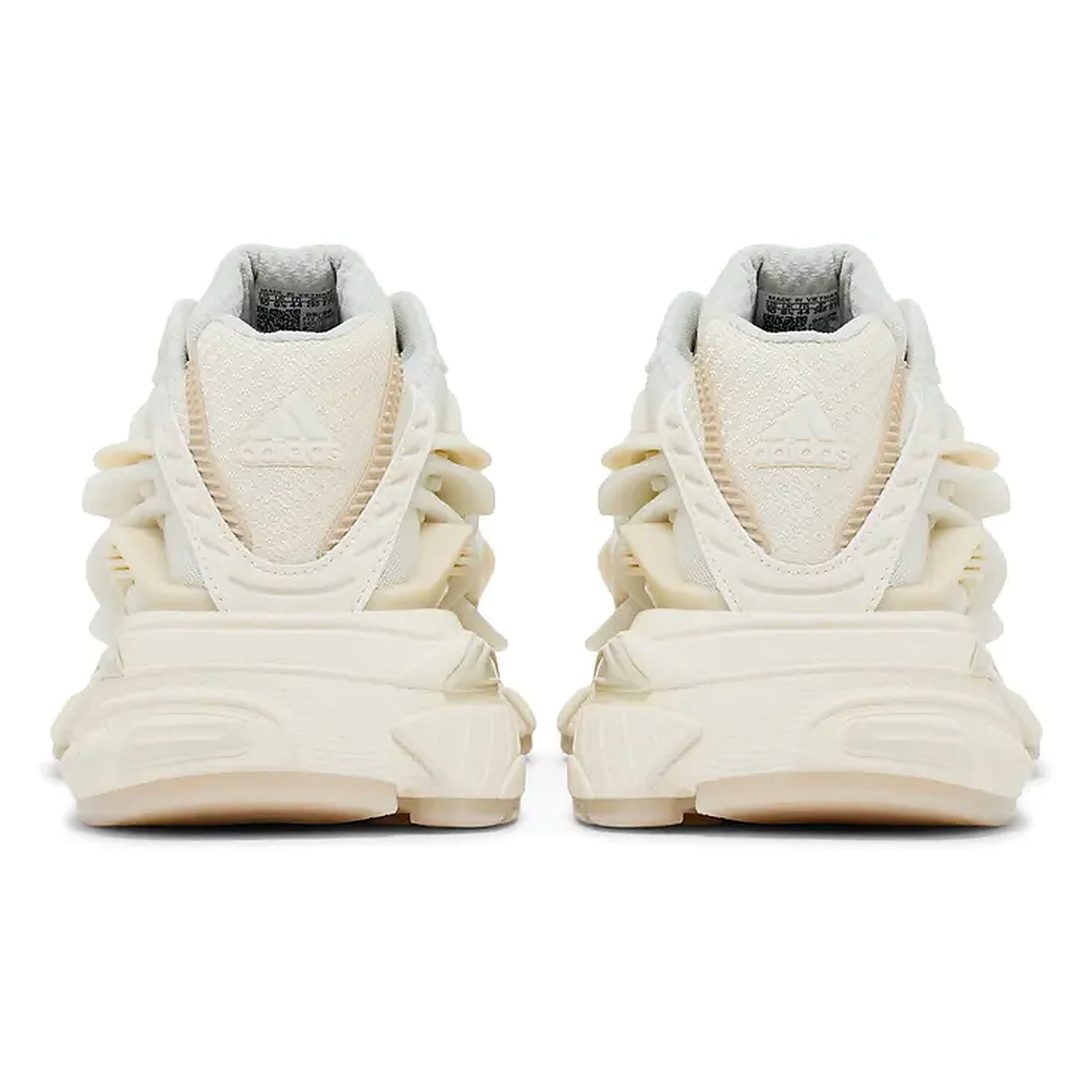 A pair of Adidas chunky sneakers shown from the back, featuring a cream and off-white colorway with textured layered details and the Adidas logo embossed on the heel.