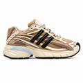 A beige and brown mesh sneaker with metallic bronze overlays, black three-stripes, a cream midsole, and a light blue accent on the heel, shown from a side profile on a white background.